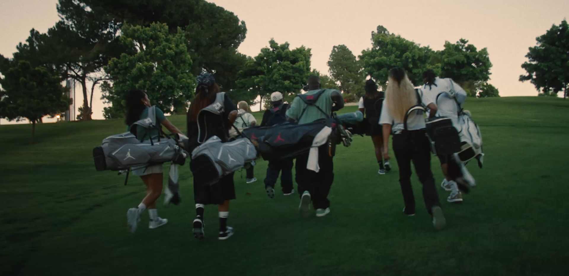 A youth sports team gathering together on a field